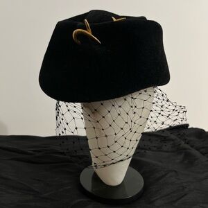 1960’s velvet pill women’s hat with net. The misses hat shop from Filene’s